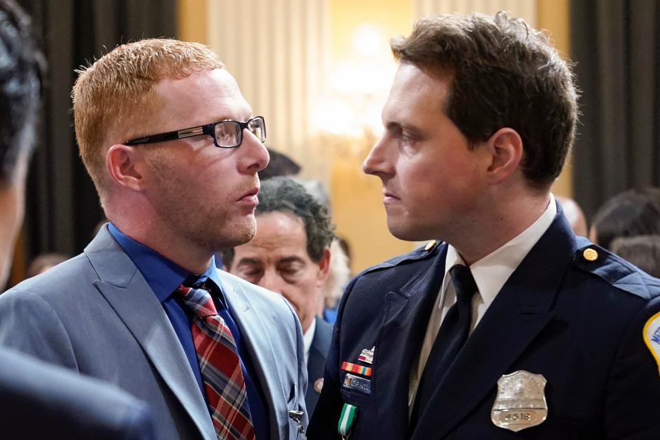 Stephen Ayres shakes hands with Washington Metropolitan Police Department officer Daniel Hodges on July 12.