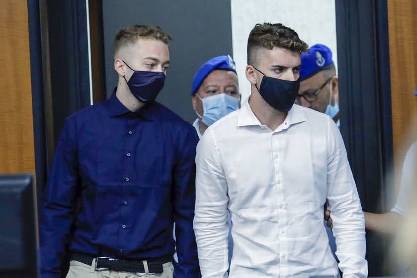 Gabriel Natale-Hjorth, right, and Finnegan Lee Elder arrive for a court hearing in Rome on Wednesday.