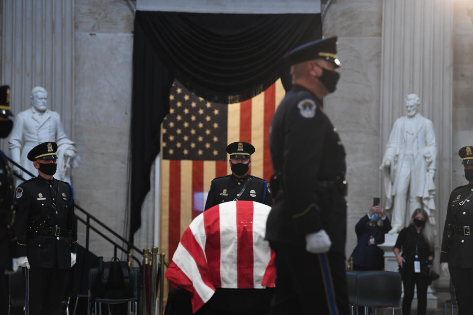 Members of the U.S. Capitol Police honor guard stand near the flag-draped casket of Rep. John Lewis, D-Ga., on Monday, July 27, 2020, in the Rotunda of the U.S. Capitol in Washington. (Matt McClain/Pool Photo via AP)