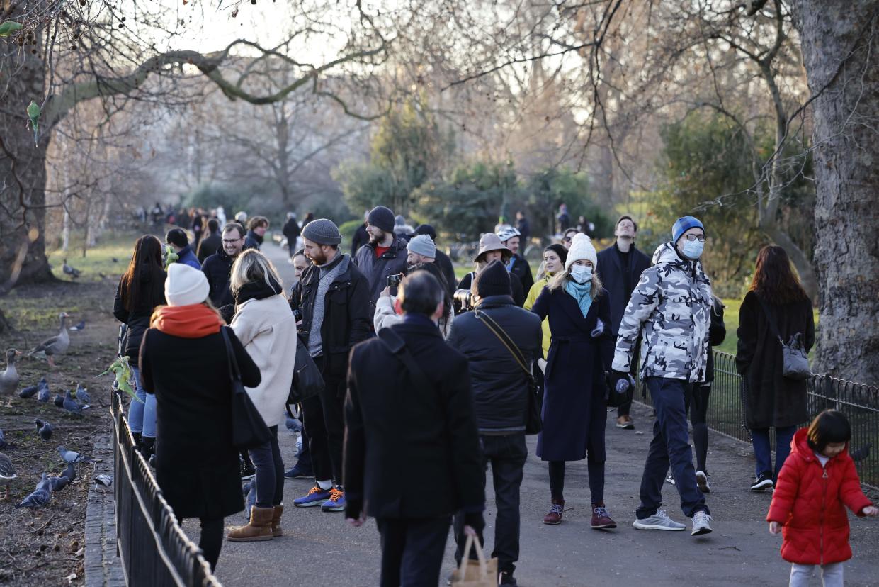 People walk in a park in central London on January 9, 2021 as life continues under Britain's third lockdown in a bid to control surging cases of Covid-19. - Britain is under a renewed lockdown to try to cut spiralling coronavirus infection rates and deaths blamed on a fast-spreading virus variant. Stay-at-home restrictions, which involve closure of school for most children and all non-essential retail, allow for some forms of outdoor exercise once per day and are expected to last until at least mid-February. (Photo by Tolga Akmen / AFP) (Photo by TOLGA AKMEN/AFP via Getty Images)