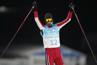 Norway's Joergen Graabak celebrates after winning the gold medal during the cross-country skiing portion of the individual Gundersen large hill/10km competition at the 2022 Winter Olympics, Tuesday, Feb. 15, 2022, in Zhangjiakou, China. (AP Photo/Alessandra Tarantino)