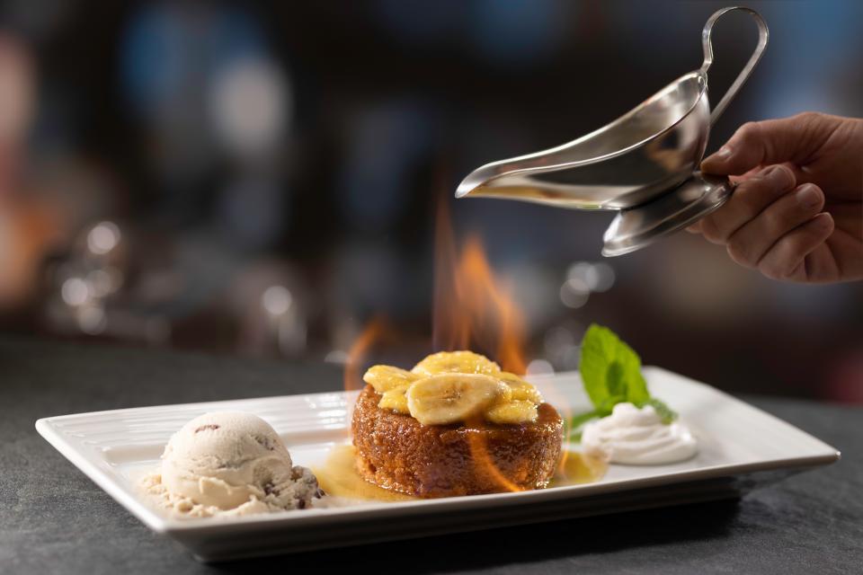 Baked fresh daily in their pastry kitchen, the bananas foster butter cake, flambeed tableside and served with butter pecan ice cream, is a bit hit.