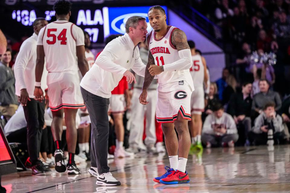 Jan 31, 2024; Athens, Georgia, USA; Georgia Bulldogs head coach Mike White talks to guard Justin Hill (11) during the game against the Alabama Crimson Tide during the second half at Stegeman Coliseum. Mandatory Credit: Dale Zanine-USA TODAY Sports