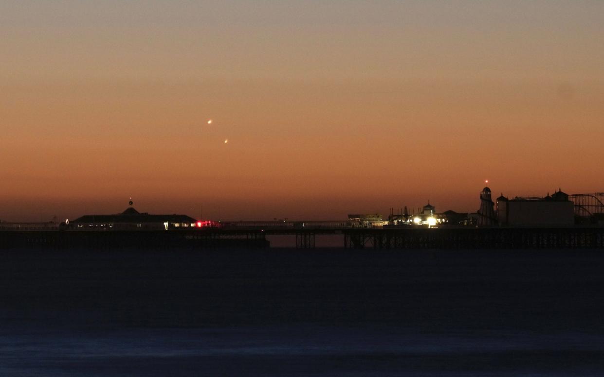 Venus and Jupiter conjunction over Brighton pier - PA