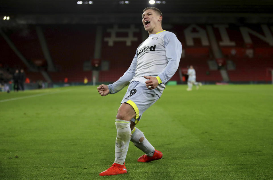 Derby County's Martyn Waghorn celebrates scoring his side's second goal of the game against Southampton, during their English FA Cup third round replay soccer match at St Mary's Stadium in Southampton, England, Wednesday Jan. 16, 2019. (Nick Potts/PA via AP)