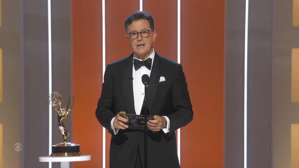 In this video grab issued Sunday, Sept. 19, 2021, by the Television Academy, Stephen Colbert presents the award for outstanding supporting actress in a drama series during the Primetime Emmy Awards. (Television Academy via AP)