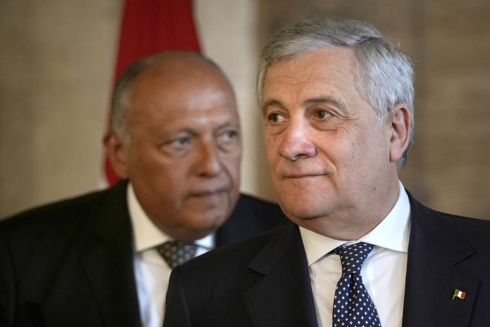 Italian Foreign Minister Antonio Tajani leaves a press conference with Egyptian counterpart Sameh Shoukry, background, at the foreign ministry headquarters in Cairo, Egypt, Sunday, Jan. 22, 2023. (AP Photo/Amr Nabil)