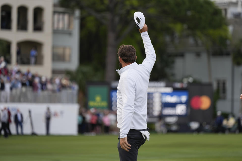 Scottie Scheffler waves after winning the weather delayed RBC Heritage golf tournament, Monday, April 22, 2024, in Hilton Head Island, S.C. (AP Photo/Chris Carlson)