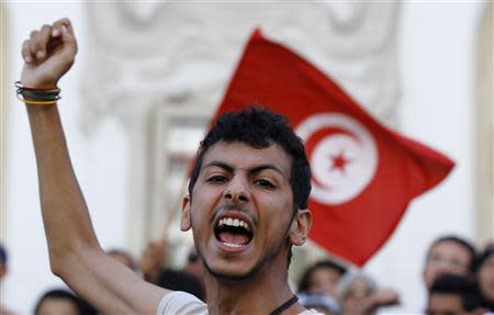 A protester shouts slogans during a demonstration calling for the departure of the Islamist-led ruling coalition in Avenue Habib-Bourguiba in central Tunis October 23, 2013. REUTERS/Anis Mili