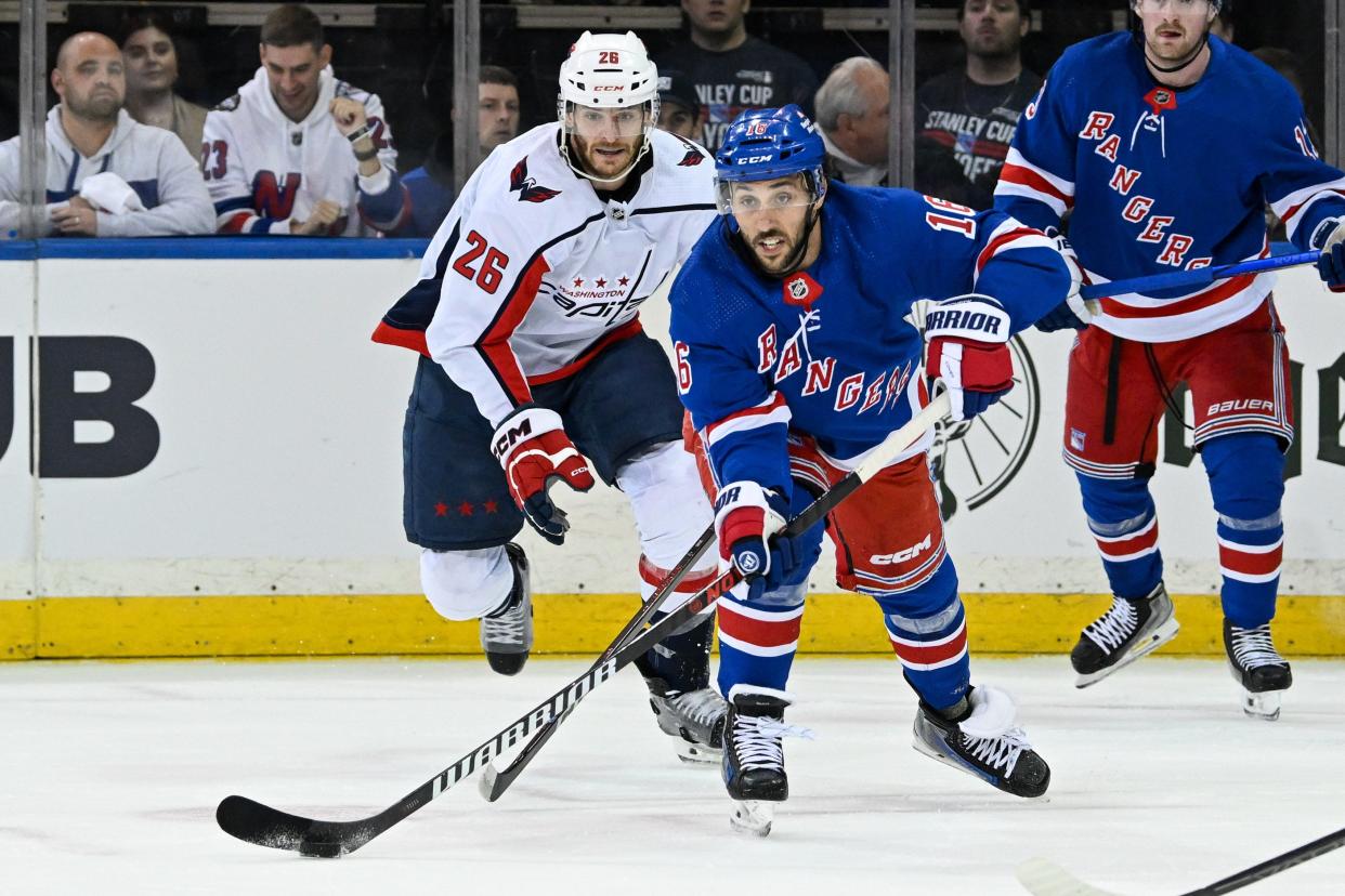 Apr 23, 2024; New York, New York, USA; New York Rangers center Vincent Trocheck (16) makes a pass defended by Washington Capitals center Nic Dowd (26) during the first period in game two of the first round of the 2024 Stanley Cup Playoffs at Madison Square Garden.