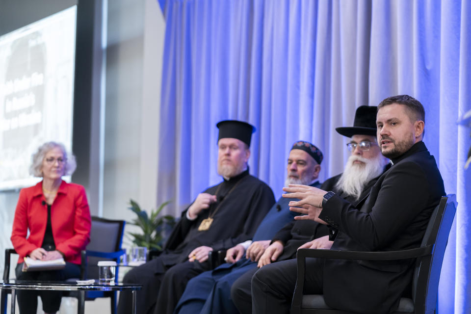 Bishop Ivan Rusyn, right, speaks during a panel discussion among an interfaith delegation of Ukrainian religious leaders including Rabbi Yaakov Dov Bleich, Mufti Akhmed Tamim and archbishop Yevstratiy Zorya (right to left), while former US ambassador to Ukraine Marie Yovanovitch, left, moderates, Monday, Oct. 30, 2023, at the U.S. Institute of Peace in Washington. (AP Photo/Stephanie Scarbrough)