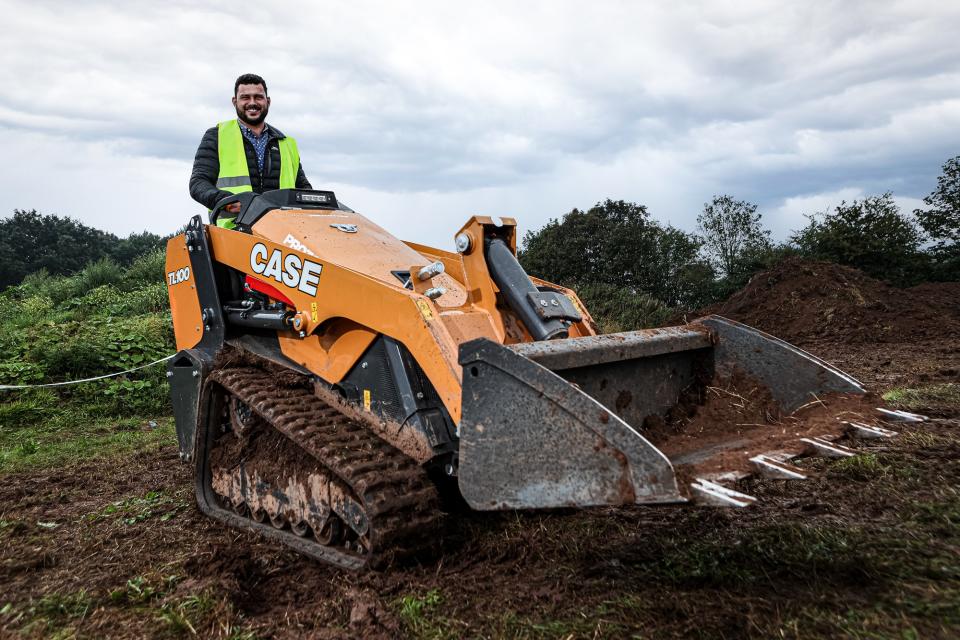 Customer operating the CASE TL100 Mini Track Loader prototype.