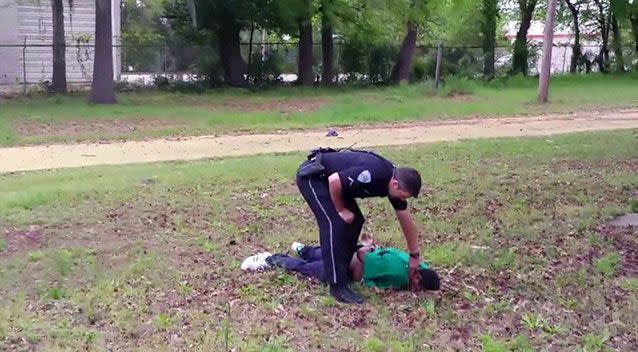 North Carolina officer Michael Slager is seen standing over Walter Scott after allegedly shooting him in the back as he fled. Photo: Reuters