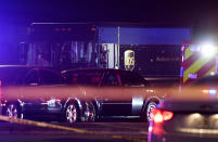 In this Thursday, Dec. 5, 2019, photo authorities investigate the scene of a shooting in Miramar, Fla. The FBI says several people, including a UPS driver, were killed after robbers stole the driver’s truck and led police on a chase that ended in gunfire at a busy South Florida intersection during rush hour. (Taimy Alvarez/South Florida Sun-Sentinel via AP)