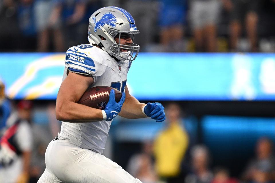 Detroit Lions tight end Brock Wright reacts after scoring a touchdown against the Los Angeles Chargers during the second half at SoFi Stadium on November 12, 2023 in Inglewood, California.