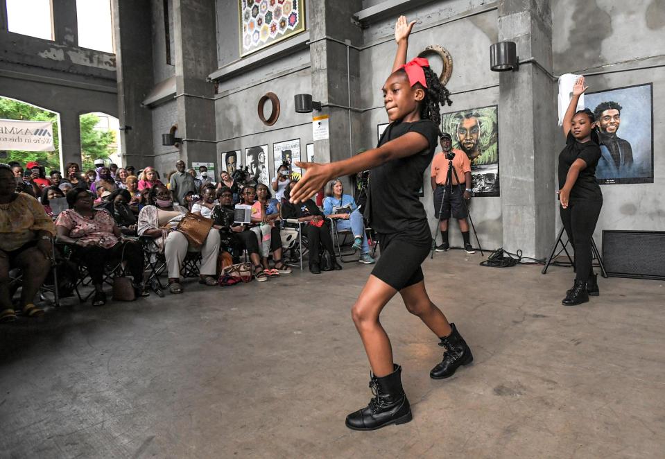 P'Asiah Sanders, 10, of Anderson, performs for the crowd with the I AM Strong Dance Company, an interpretive dance group, during the Anderson Area Remembrance and Reconciliation Initiative's Juneteenth event at Carolina Wren Park in downtown Anderson, Saturday June 19, 2021 . 