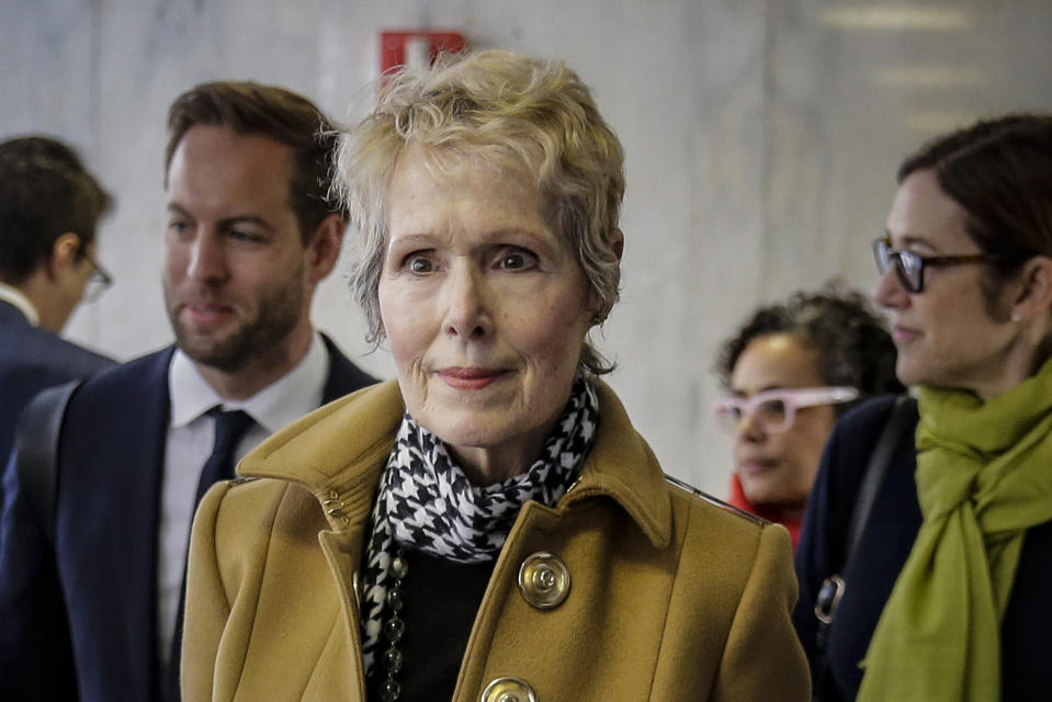 FILE - E. Jean Carroll, center, waits to enter a courtroom in New York for her defamation lawsuit against President Donald Trump, March 4, 2020. A federal judge wants to know if ex-President Trump plans to attend a New York trial in April 2023, resulting from Carroll's claims that he raped her in a department store dressing room in the 1990s. (AP Photo/Seth Wenig, File)