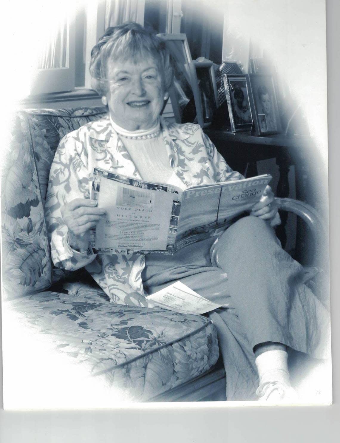 In this undated photo, Sallye Jude sits at home at her Java Head estate in Coral Gables reading Preservation Today magazine, published by Dade Heritage Trust, where she was a founding member in the early 1970s.