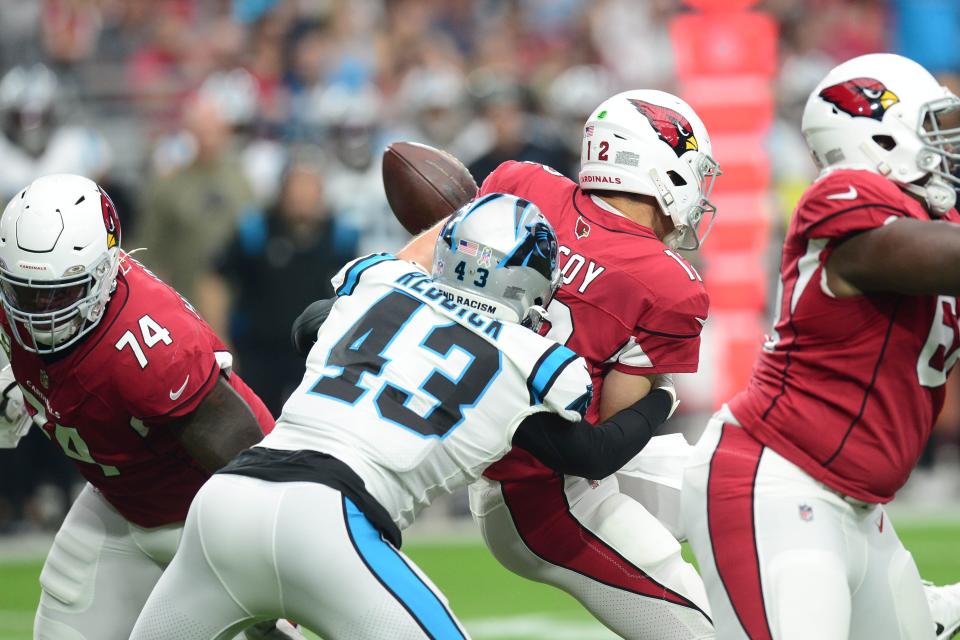 Nov 14, 2021; Glendale, Arizona, USA; Carolina Panthers outside linebacker Haason Reddick (43) sacks and strips Arizona Cardinals quarterback Colt McCoy (12) of the ball during the first half at State Farm Stadium. Mandatory Credit: Joe Camporeale-USA TODAY Sports