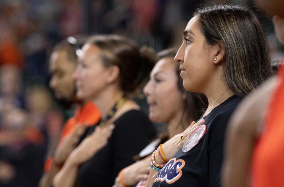 Uvalde resident Faith Mata, who threw out the first pitch before the Houston Astros' game against the Oakland Athletics, takes a moment of silence for the Ulvade children who were killed in the mass shooting on May 24. Faith Mata's sister Tess Mata, age 10 who was in the fourth grade, was killed in the mass shooting.