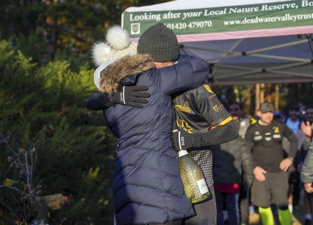 Veteran Brian Wood MC hugs his partner Lucy 