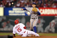 ST LOUIS, MO - OCTOBER 28: Ian Kinsler #5 of the Texas Rangers turns the double play as Rafael Furcal #15 of the St. Louis Cardinals slides into second base in the second inning during Game Seven of the MLB World Series at Busch Stadium on October 28, 2011 in St Louis, Missouri. (Photo by Jamie Squire/Getty Images)