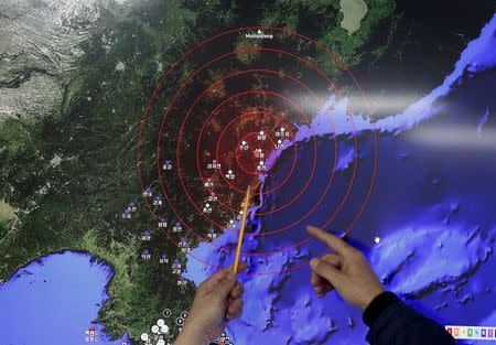 Ko Yun-hwa (L), Administrator of Korea Meteorological Administration, points at where seismic waves observed in South Korea came from, during a media briefing at Korea Meteorological Administration in Seoul, South Korea, in this January 6, 2016 file photo. North Korean leader Kim Jong Un's recent nuclear weapon test was designed to boost his domestic legitimacy ahead of a rare ruling party conference in May that could formalise market-based economic experiments in the isolated country, analysts say. Picture taken January 6, 2016. REUTERS/Kim Hong-Ji/Files