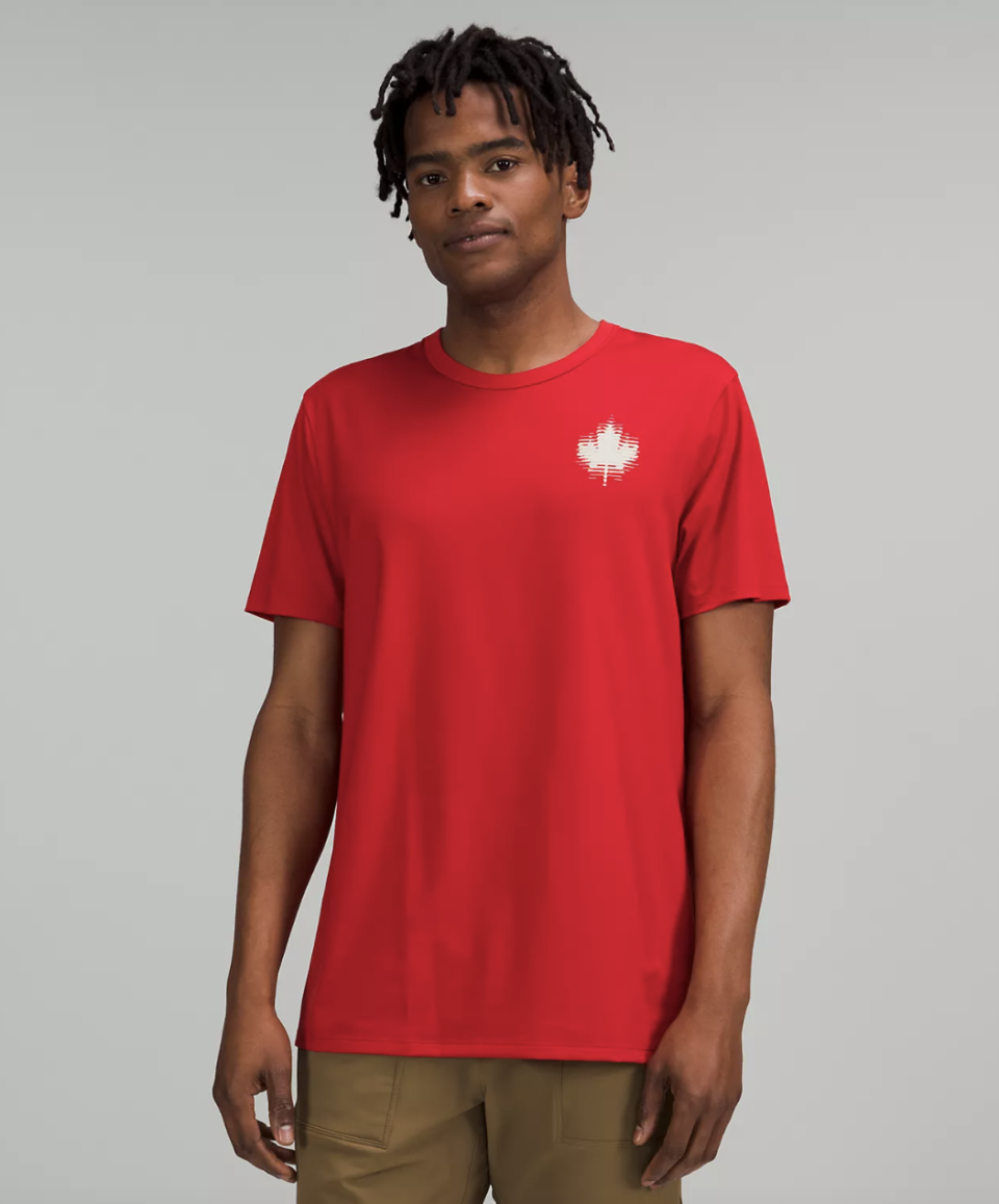 man wearing red t-shirt with white maple leaf Team Canada The Fundamental T-Shirt COC Logo (Photo via Lululemon)