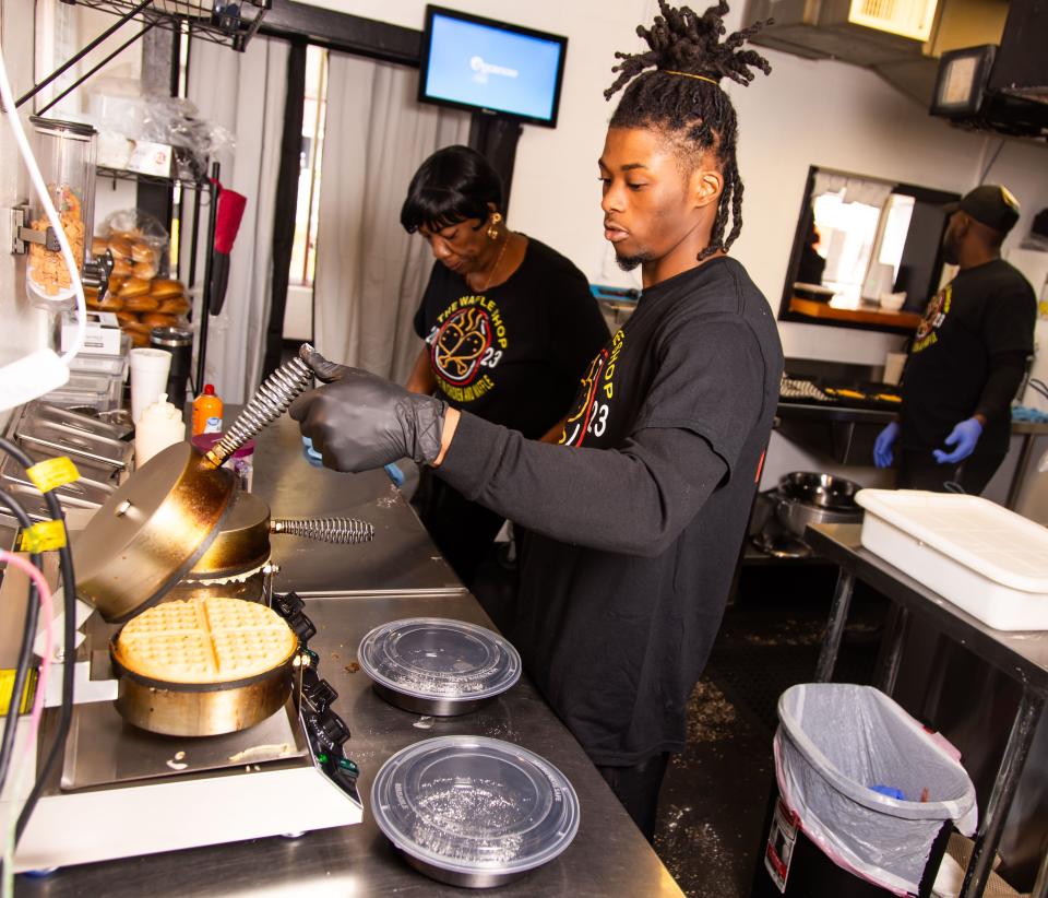 Jabraun Evans makes waffles at The Waffle Shop, 2507 NE Jacksonville Road in Ocala, on Feb. 5.