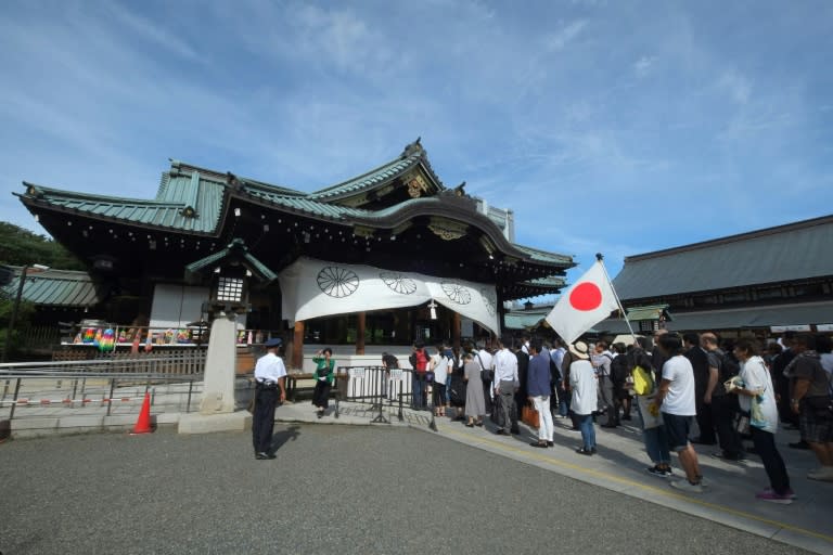 A shrine spokeswoman acknowledged the chief priest's resignation was linked to the magazine article