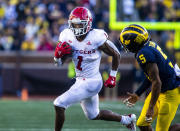 Rutgers running back Isaih Pacheco (1) rushes against Michigan defensive back DJ Turner (5) in the fourth quarter of an NCAA college football game in Ann Arbor, Mich., Saturday, Sept. 25, 2021. Michigan won 20-13. (AP Photo/Tony Ding)