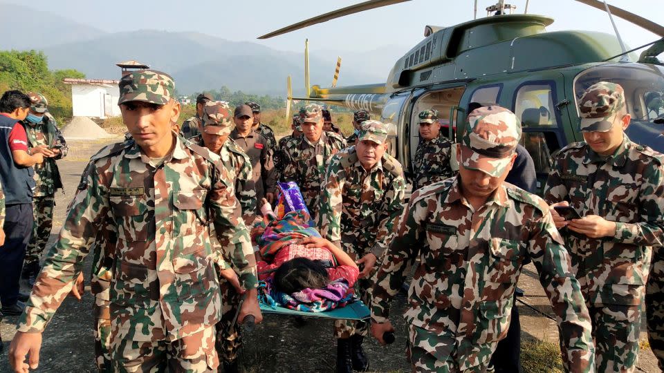 Army personnel carry an injured person on a stretcher after an earthquake in Jajarkot, Nepal, on November 4, 2023. - Nepal Army/Handout/Reuters