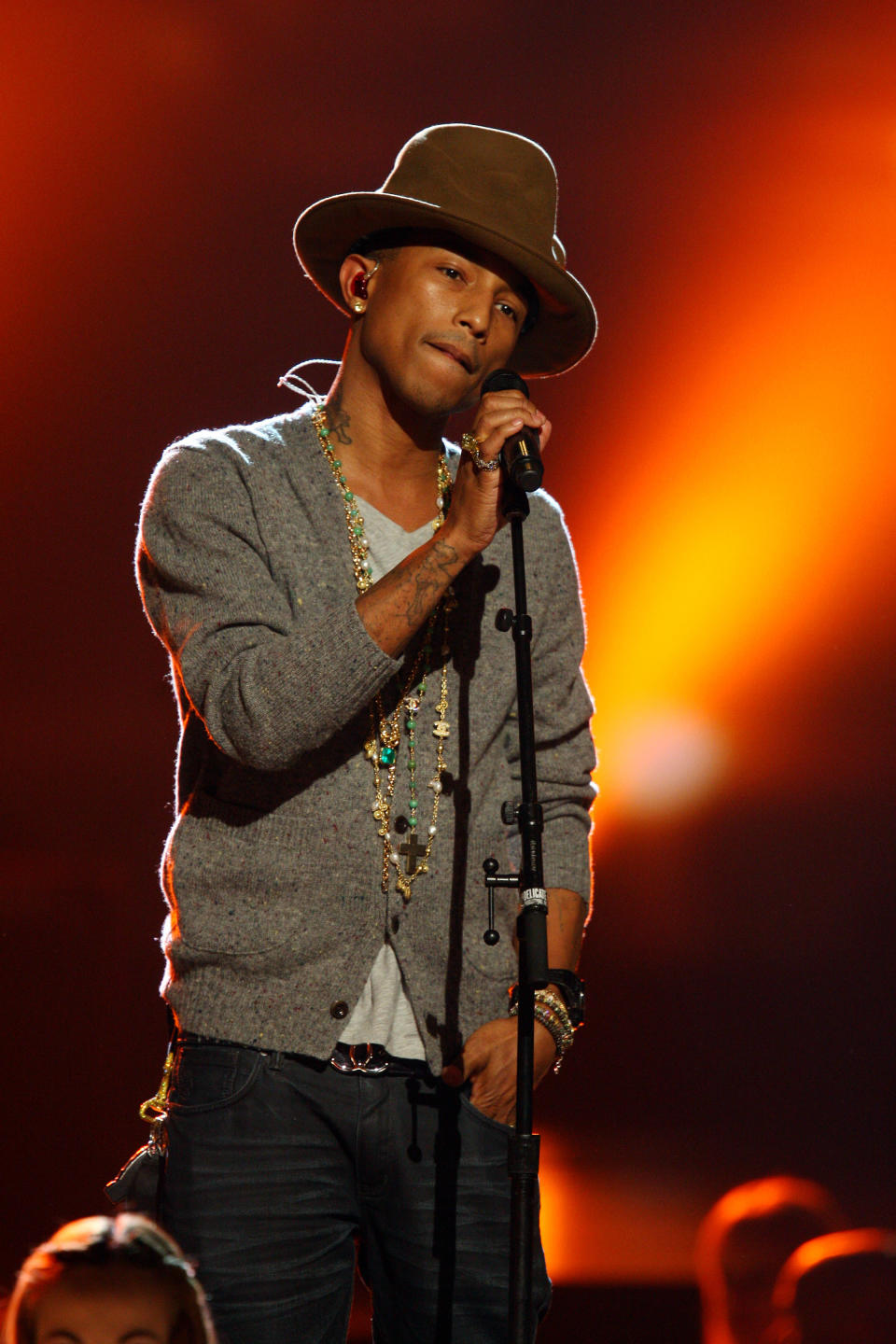 FILE - This Jan. 27, 2014 file photo shows Pharrell Williams performing at The Night that Changed America: A Grammy Salute to the Beatles in Los Angeles. This week Pharrell released his sophomore solo album, “G I R L,” which features the Oscar-nominated hit, “Happy.” The song is spending its second week on top of the Billboard Hot 100 chart. (Photo by Zach Cordner/Invision/AP, File)