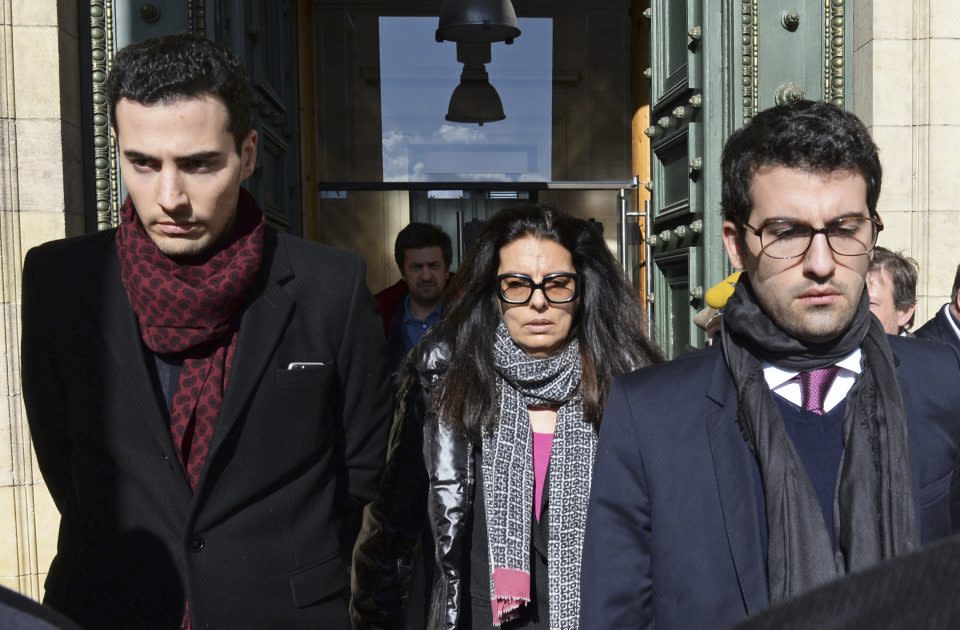 Francoise Bettencourt Meyers (C) leaves with her sons Nicolas (L) and Jean-Victor (R)