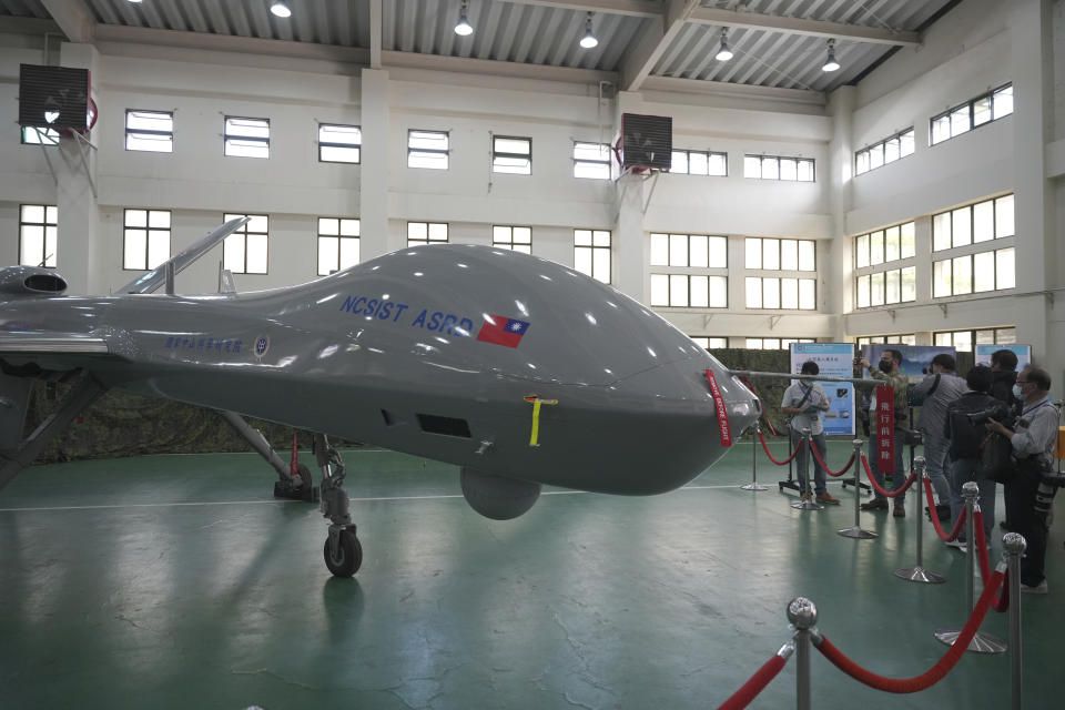 Members of the media look at the Taiwanese developed large UAV Teng Yun, which resembles the American MQ-9 Reaper and can stay aloft for up to 24 hours at the National Chung-Shan Institute of Science and Technology in Taichung in central Taiwan on Tuesday, Nov. 15, 2022. Taiwan displayed its self-developed drone technology Tuesday, amid rising concerns over China's threats to use force to assert its claim to the self-governing island republic. (AP Photo/Walid Berrazeg)