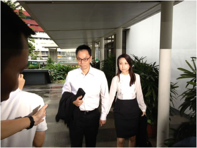 <p>Former CNB chief Ng Boon Gay and his wife arrive at the subordinate courts for his verdict in the sex-for-contracts case. He was found not guilty. (Yahoo! photo)</p>