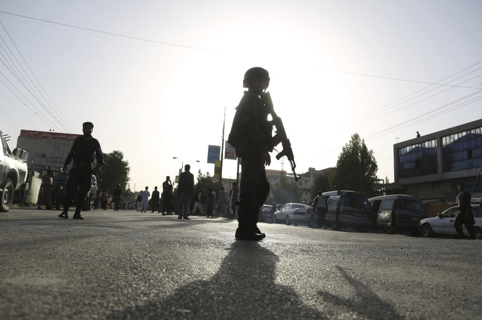 Security personnel arrived at the site of a deadly suicide bombing that targeted a training class in a private building in the Shiite neighbourhood of Dasht-i Barcha, in western Kabul, Afghanistan, Wednesday, Aug. 15, 2018. Both the resurgent Taliban and an Islamic State affiliate in Afghanistan have targeted Shiites in the past, considering them to be heretics. (AP Photo/Rahmat Gul)