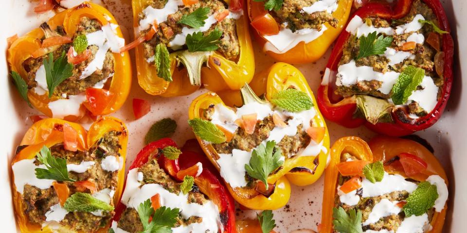 multicolored peppers stuffed with shawarma and drizzled with a cream sauce and mint