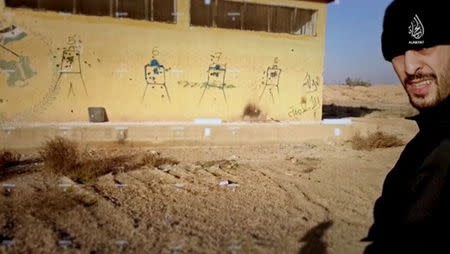 A screenshot of a man referred to by his nom de guerre as 'Abul Qa'Qa' al-Baljiki' is seen in this image taken from an undated video. REUTERS/al-Hayat Media Center of IS via Reuters