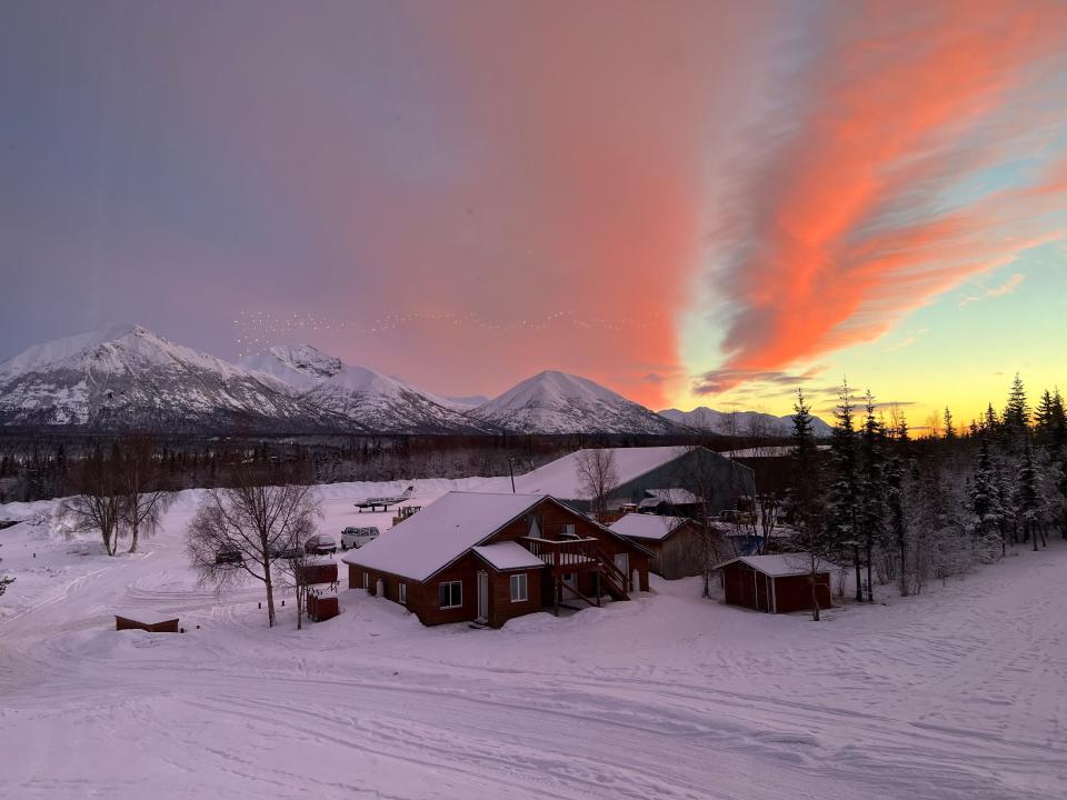 sun setting over a remote alaskan town