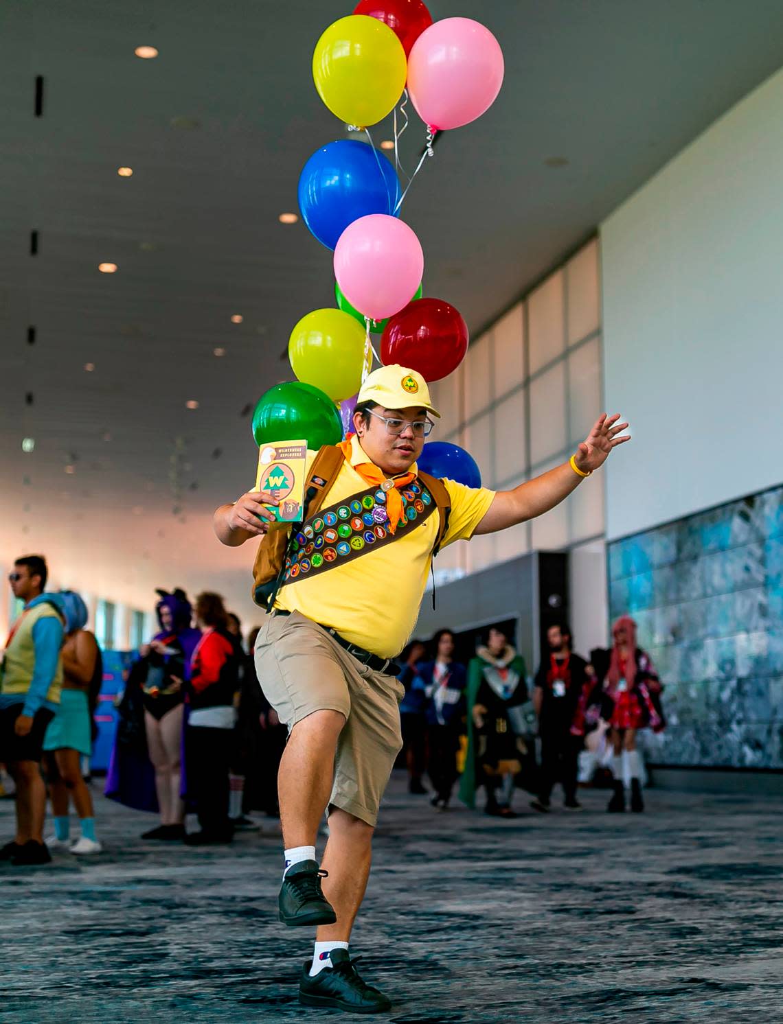Mauricio Rodrigues cosplays as Russell from the Disney movie “Up” during Florida Supercon.