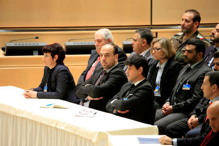 Head of opposition delegation Nasr al-Hariri (front 2nd L) listens during the speech of United Nations Special Envoy for Syria Staffan de Mistura in the context of the resumption of intra-Syrian talks at the Palais des Nations in Geneva, Switzerland, February 23, 2017. REUTERS/Pierre Albouy