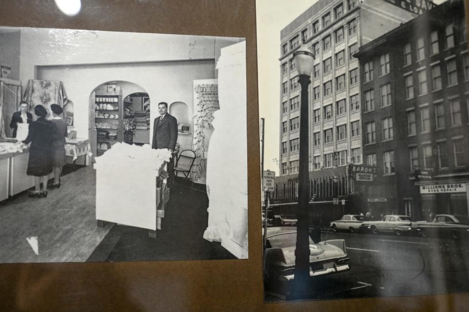 At left, Herman Baron stands inside his Baron's Window Coverings store. At right is the store's original location on Allegan Street. The photos hang in the store on Thursday, Sept. 21, 2023, in downtown Lansing.