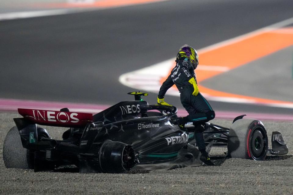 Lewis Hamilton was sent spinning into the gravel (AP)