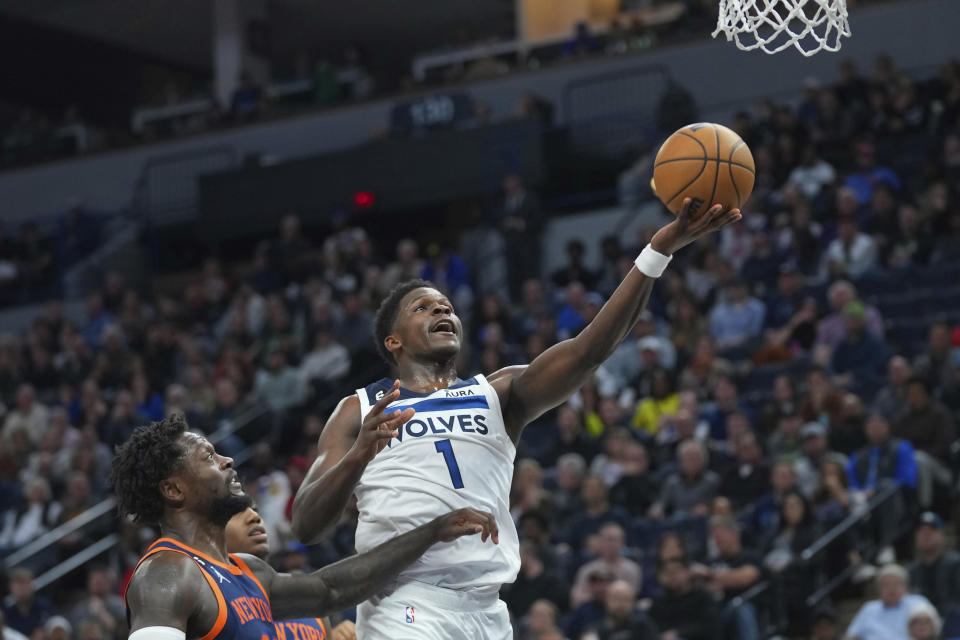 Minnesota Timberwolves guard Anthony Edwards (1) shoots against New York Knicks forward Julius Randle, left, during the first half of an NBA basketball game, Monday, Nov. 7, 2022, in Minneapolis. (AP Photo/Abbie Parr)