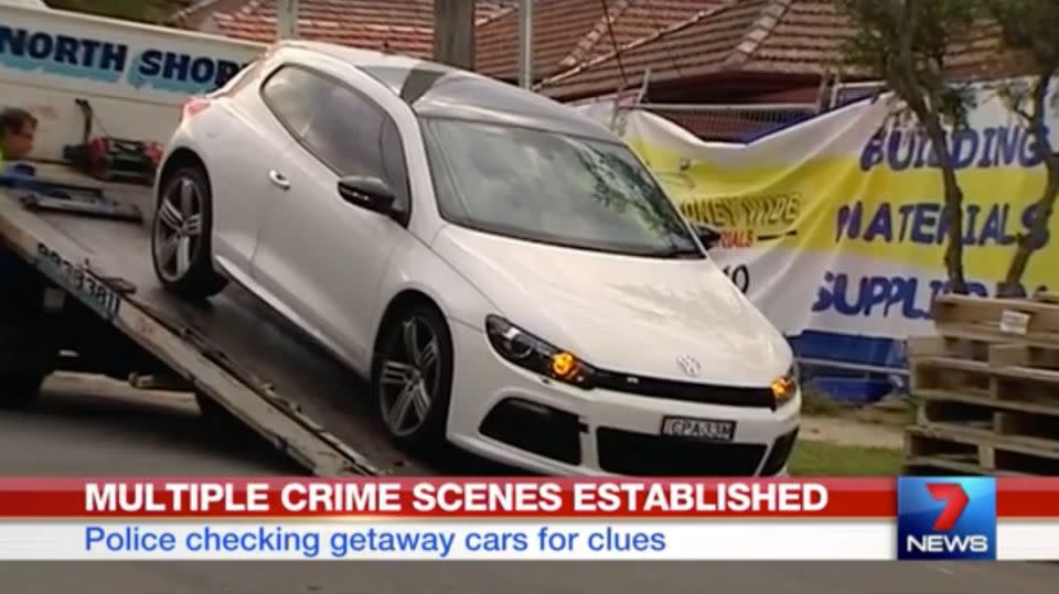 One of the vehicles, believed to be a getaway car, is taken away as evidence. Photo: 7 News