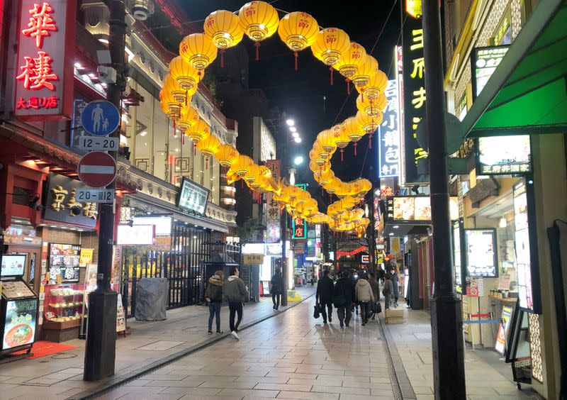 Passersby are seen on a street in Yokohama’s China Town inn Yokohama, Japan