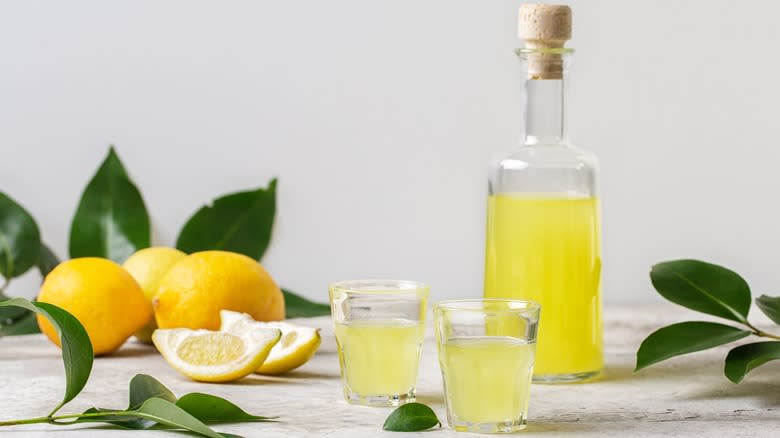 small glasses of limoncello with bottle