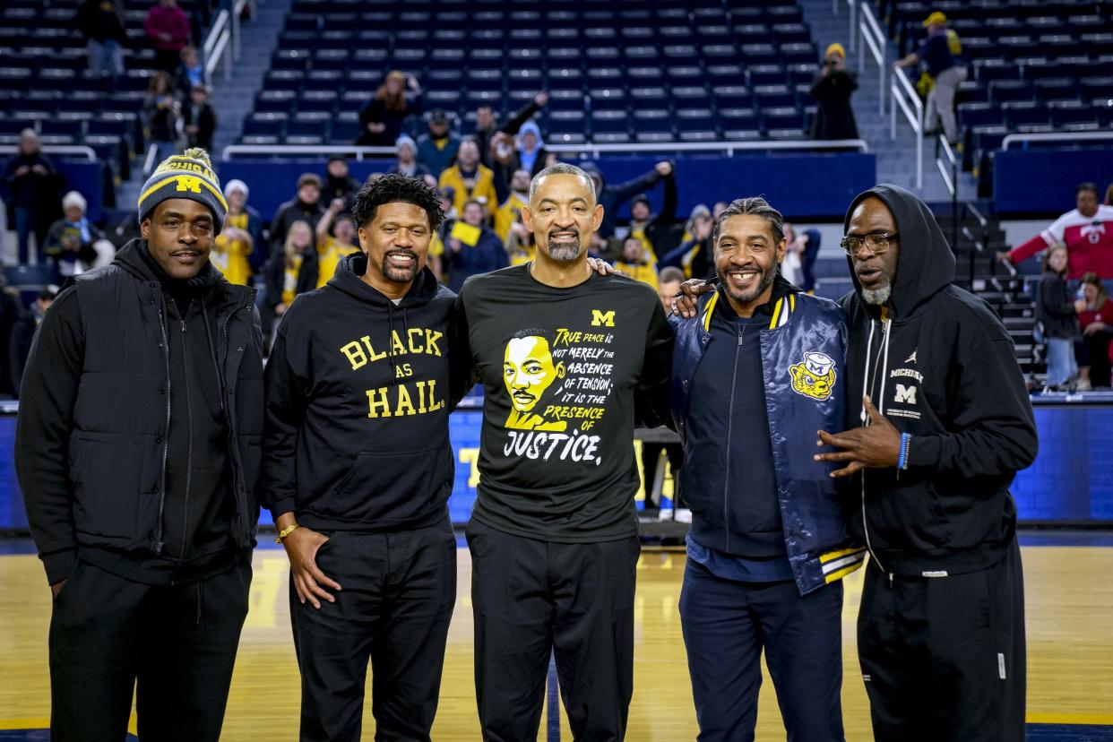 (From left) Michigan's Fab Five, Chris Webber, Jalen Rose, U-M head coach Juwan Howard, Jimmy King, and Ray Jackson, pose for a photo after U-M's 73-65 win on Monday, Jan. 15, 2024, at Crisler Center.