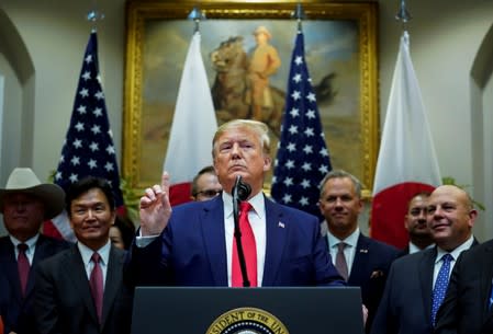 FILE PHOTO: U.S. President Donald Trump speaks about Syria and Turkey during signing ceremony for the U.S.-Japan Trade Agreement at White House in Washington